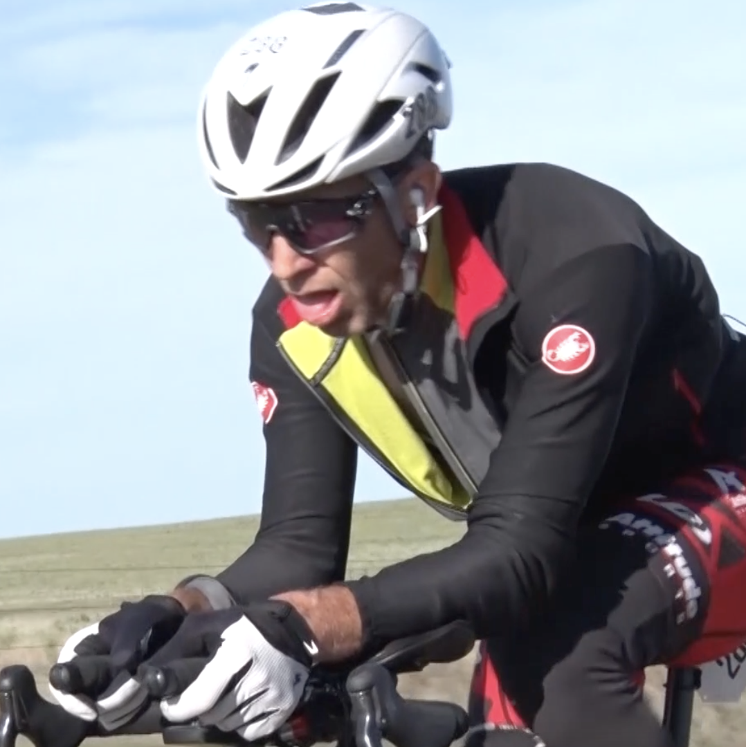 This image features an intense close-up of a competitive cyclist pushing through fatigue during a long-distance ride, highlighting the grit and emotion that make for compelling documentary storytelling. Ideal for promoting documentary video services that focus on personal journeys, athletic endurance, human achievement, and real-life narratives. This frame showcases the raw, unscripted moments that define documentary filmmaking and connect deeply with audiences across platforms.