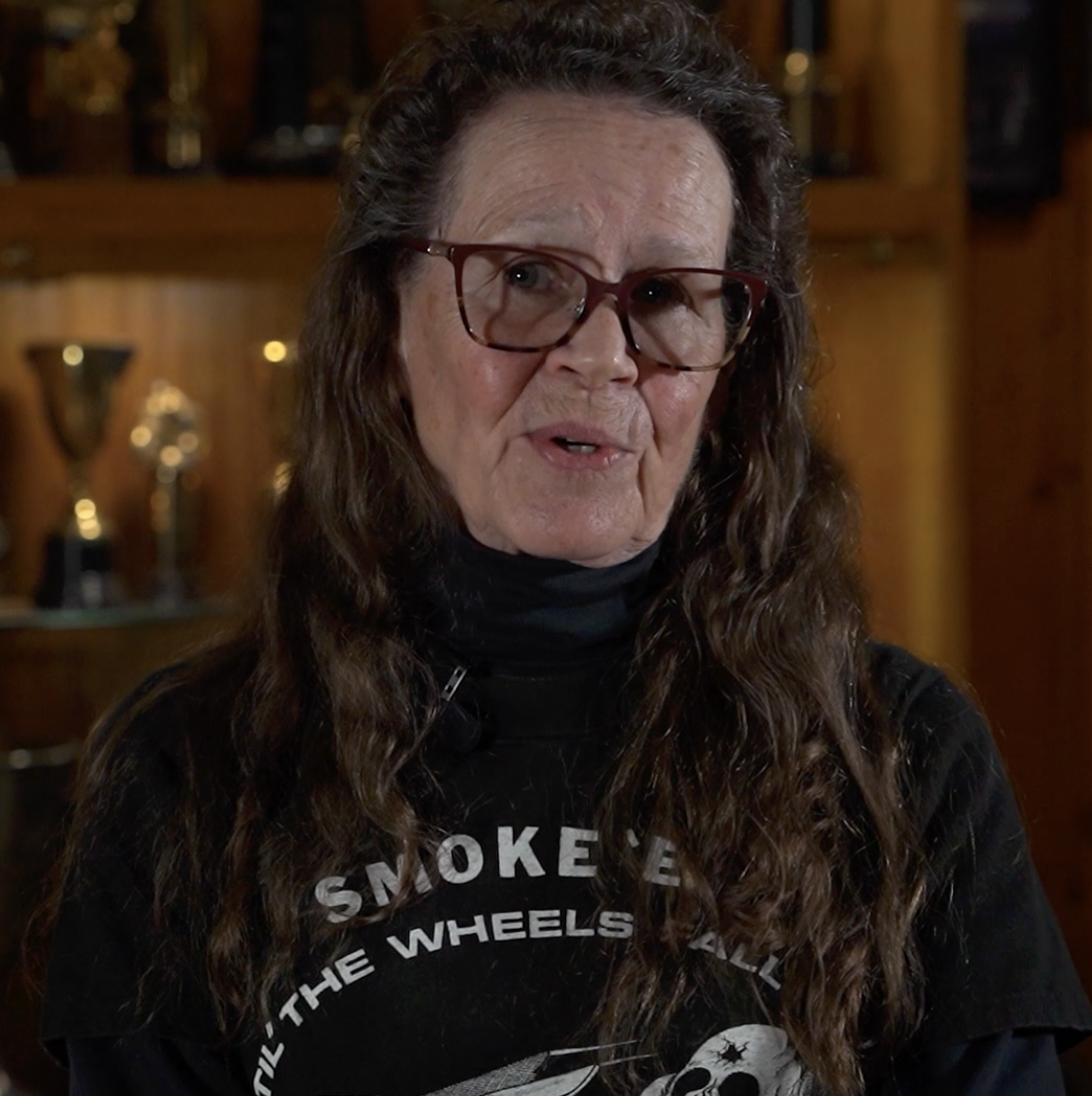 Senior woman sharing personal memories during a filmed memorial tribute interview, part of a professional legacy and memorial video production.